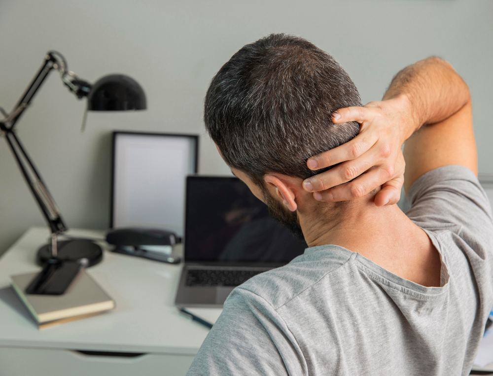 Adult experiencing neck discomfort consistent with whiplash symptoms
